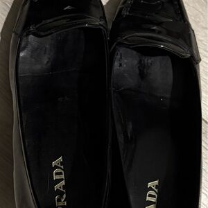 Women’s Prada black patent leather shoe with pointed toe